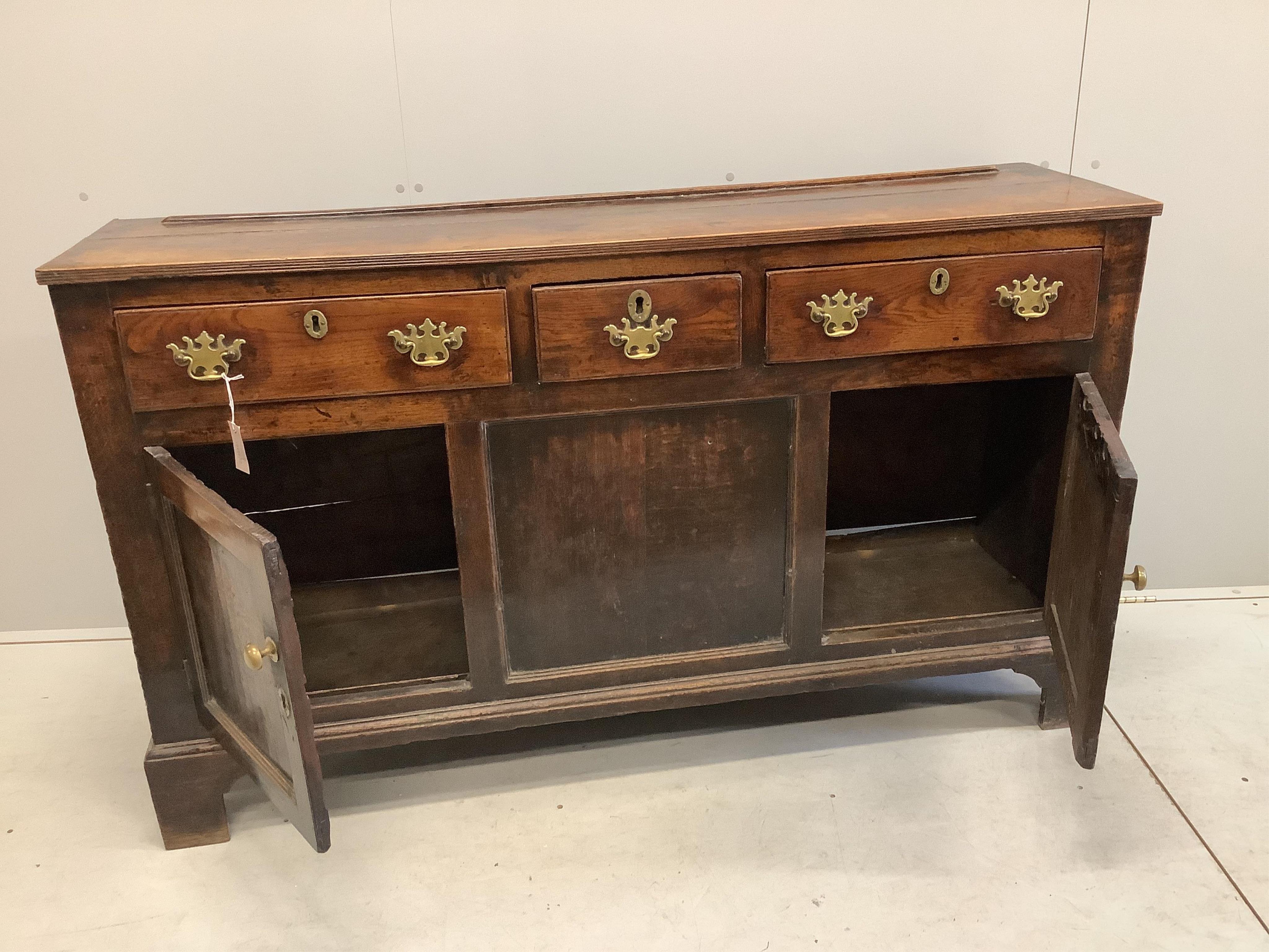 An 18th century oak low dresser, width 154cm, depth 42cm, height 90cm. Condition - fair